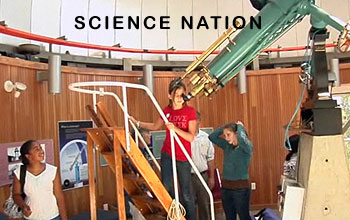 Photo of several girls and a telescope under the words, Science Nation