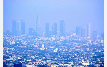 Photo showing haze and smoke covering the skyline of Los Angeles, California.