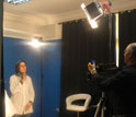 A videographer and a Moroccan Sign Language interpreter record signs in a studio