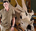 Photo of Scott Sampson with the skull of Utahceratops gettyi.