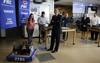President Obama tours a classroom at Manor New Technology High School in Manor, Texas