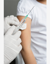 Photo of a health care professional administering a vaccine.