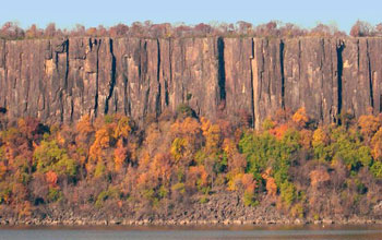View of Palisade Sill near Alpine, N.J., from across a river.