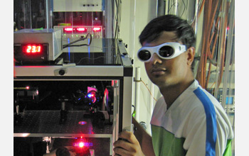 Photo of Apratim Dhar at the FReI instrument.