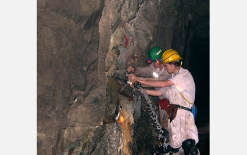 Undergraduate students prepare to collect water samples deep in South African gold mine