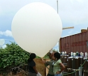 Scientists and graduate students launch a weather balloon from Kawsara, Senegal.