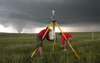 Photo of IGERT trainees deploying a portable weather station.