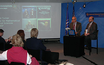 Participants at the live webcast in the studio and on screen.