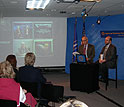 Participants at the live webcast in the studio and on screen.