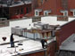 Photo of a construction crew painting a white roof in downtown Washington, D.C.