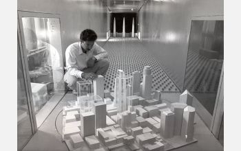 A model of downtown Minneapolis, Minn., is prepared for testing in the boundary layer wind tunnel