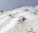 Stripes of dust visible on the snow in Colorado's Rocky Mountains.