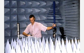 Ph.D. student working in the IMSC's radio frequency anechoic chamber and control room