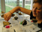 Arianne Cease checks her locust experiments