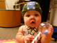 a baby wearing an EEG cap