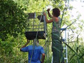 Bethany Krebs (on ladder) assembling a flight cage