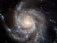 a giant spiral disk of stars, dust and gas