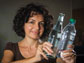 Elisa Riedo poses with a glass and plastic bottle