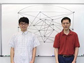 researchers in front of a white board