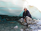 Mark Urban under a sheet of aufeis in Alaska