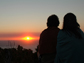 a couple watching the sun set