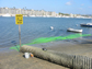 end of storm drain on a beach