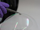 a working cell on top of a soap bubble