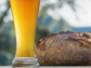 a glass of wheat beer and bread