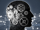 silhouetted head in profile with gears and futuristic shape in background