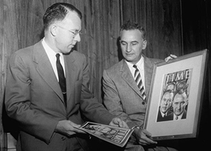 Dean Wooldridge 
      and Simon Ramo (right) compare their pictures in a painting on the cover of TIME Magazine in 1957