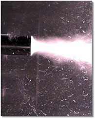 a cloud of gas bubbles in a liquid excited by ultrasound; caption is below