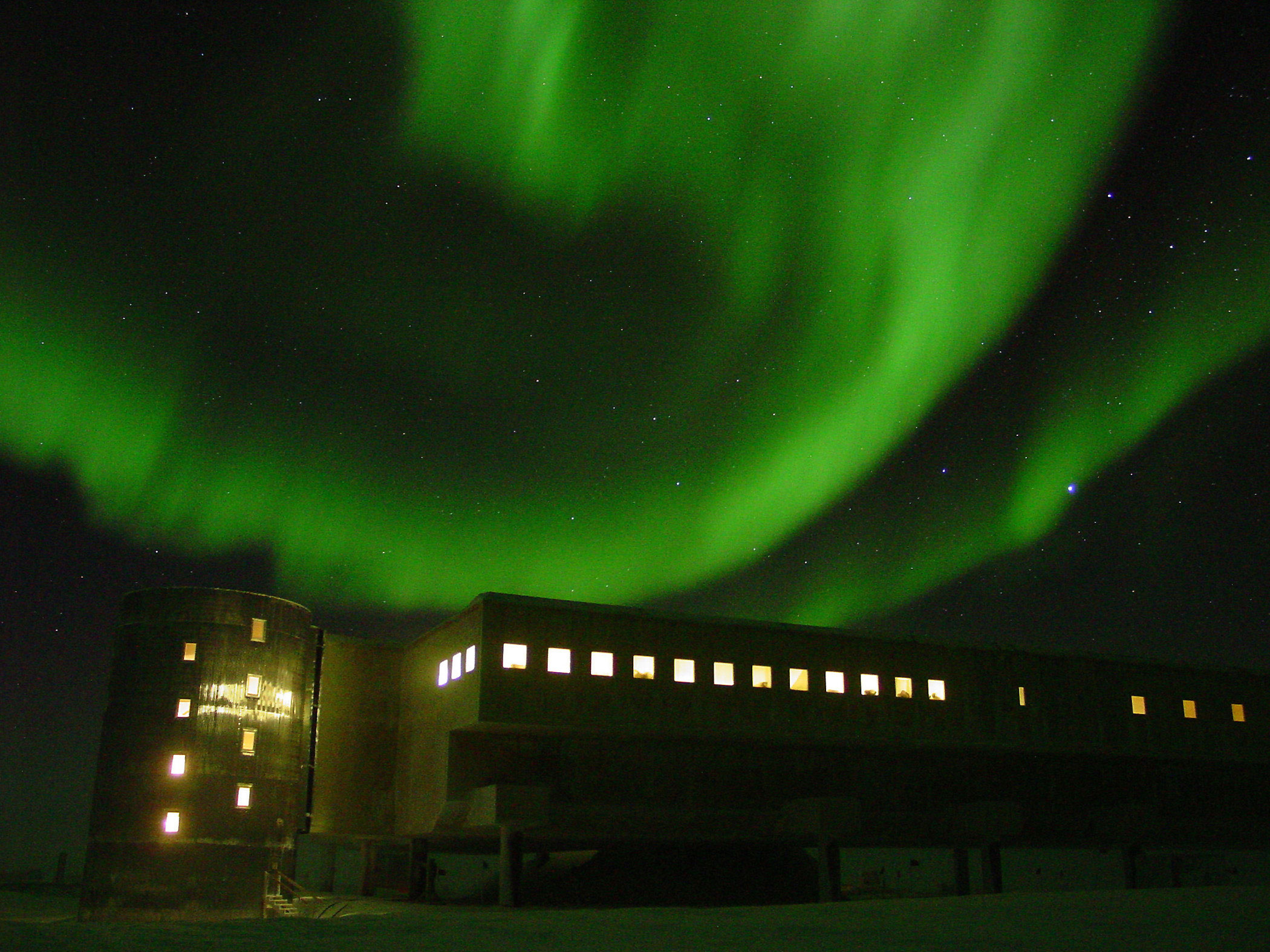 the Southern lights, over NSF's station at the South Pole; caption is below