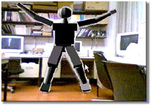 a humanoid puppet doing jumping jacks