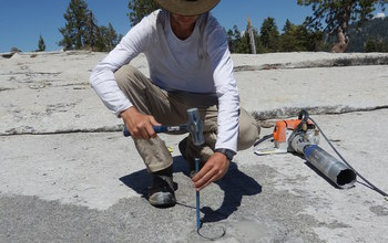 Researcher  extracting a granite core