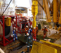 Researchers prepare wellhead as part of an observatory