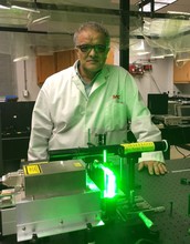Aristides Marcano, professor of physics at Delaware State University, works in the school's laboratory of quantum optics.