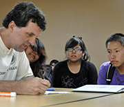 Kansas State University David Auckly works with students at a summer math camp.