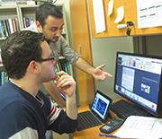 Two students at The City College of New York discuss a research project.