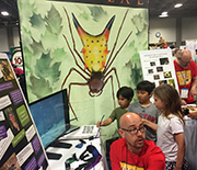 Researchers and children interacting at the 