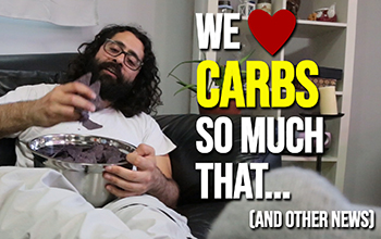 man eating chips on the couch with text saying we love carbs so much that...