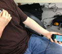 Photo of man with statoscope and holding a smart phone with app that can monitor vitals