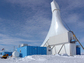 a drilling rig in the Antarctic with blue skies in the background