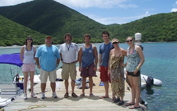 Paul Sikkel  with colleagues standing next to water at Virgin Islands Environmental Resource Station