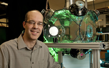 Scientist Raymond Shaw and a research device