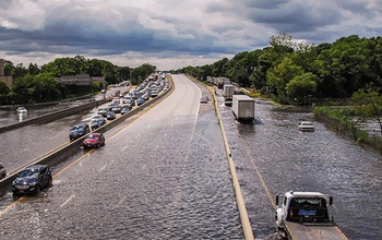 Highway to nowhere: Traffic along a road near Islip, New York, is stalled by heavy rains.