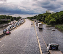 Highway to nowhere: Traffic along a road near Islip, New York, is stalled by heavy rains.