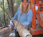 Female scientist holds equipment that helps study water flow.