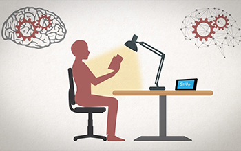 graphic of a person sitting at a desk