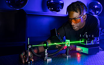ATE student learning to measure output power from a laser