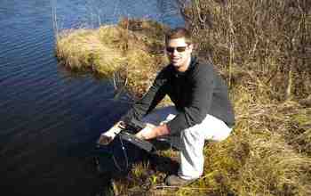 Scientist Ryan Batt obtains readings of oxygen levels in a lake in northern Wisconsin.